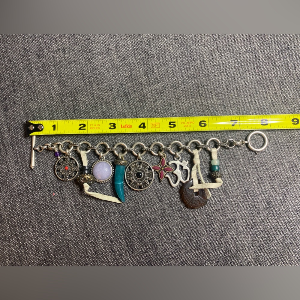 Lucky Brand silver toned toggle bracelet with 9 charms. - Picture 6 of 7
